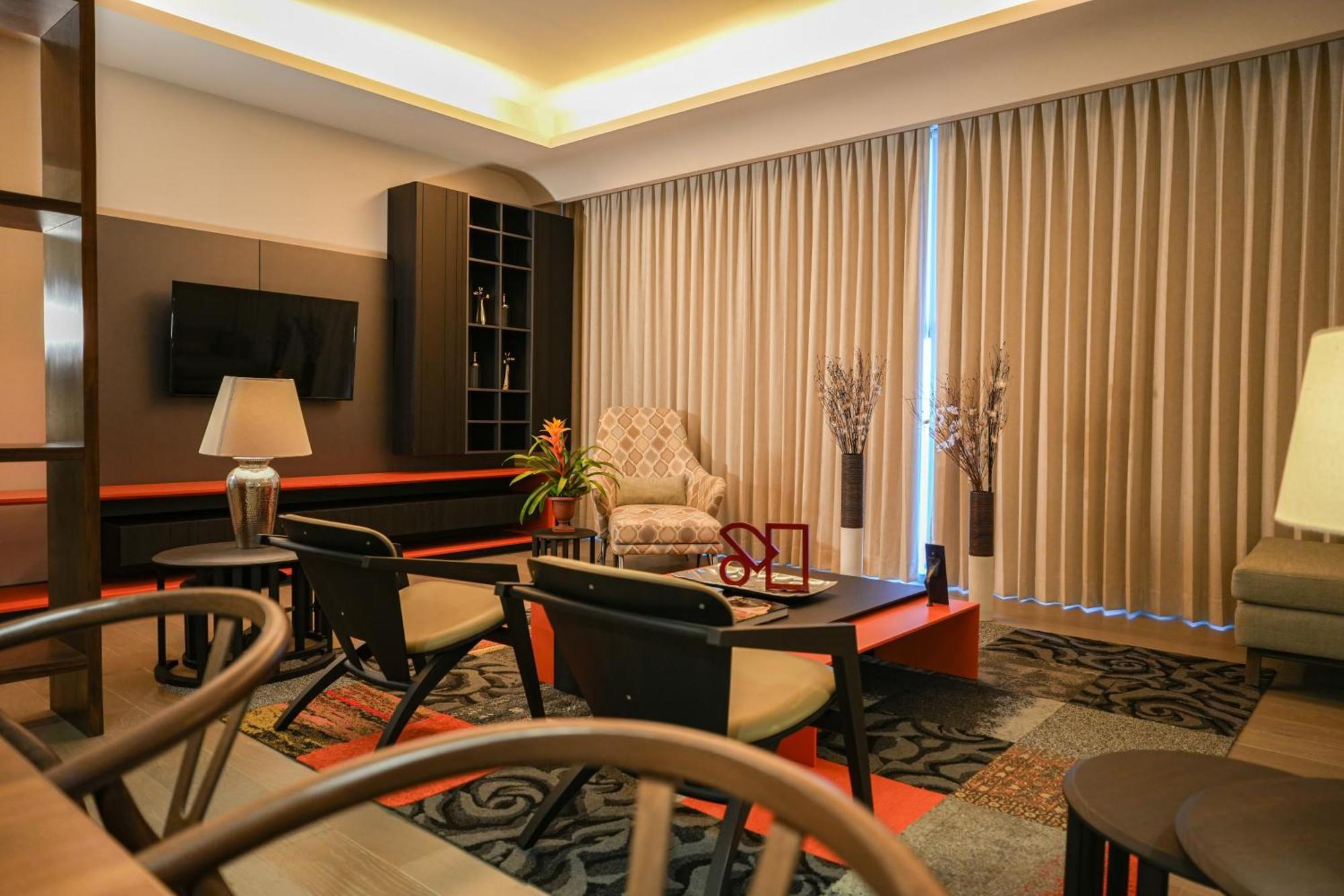 Metria Hotel León Exterior foto A living room in a condominium